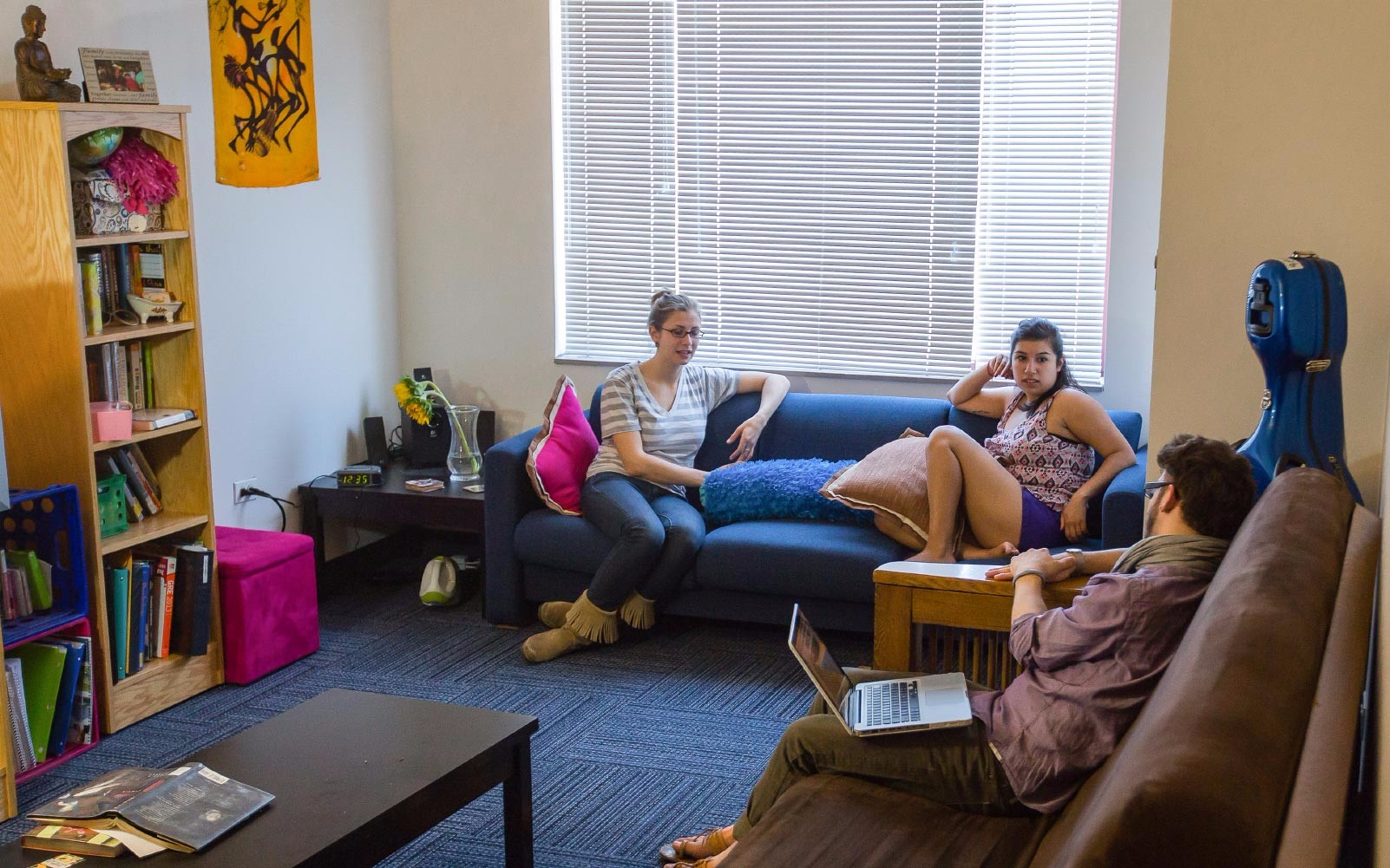 Students lounging in a dorm room.